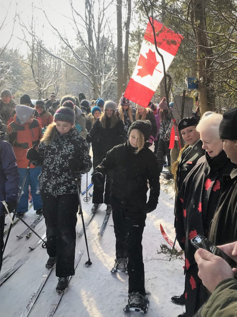 The Lieutenant Governor greets students cross country skiing on the new Canada 150 trail