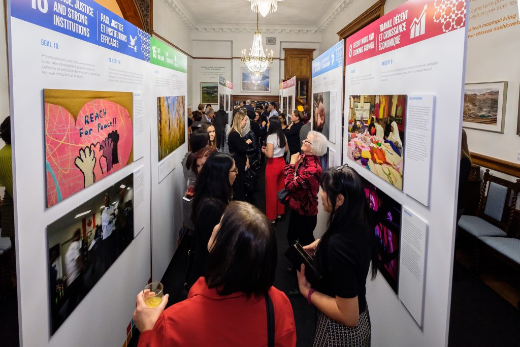 Guests look at the Our Sustainable Future exhibition on display at Queen's Park