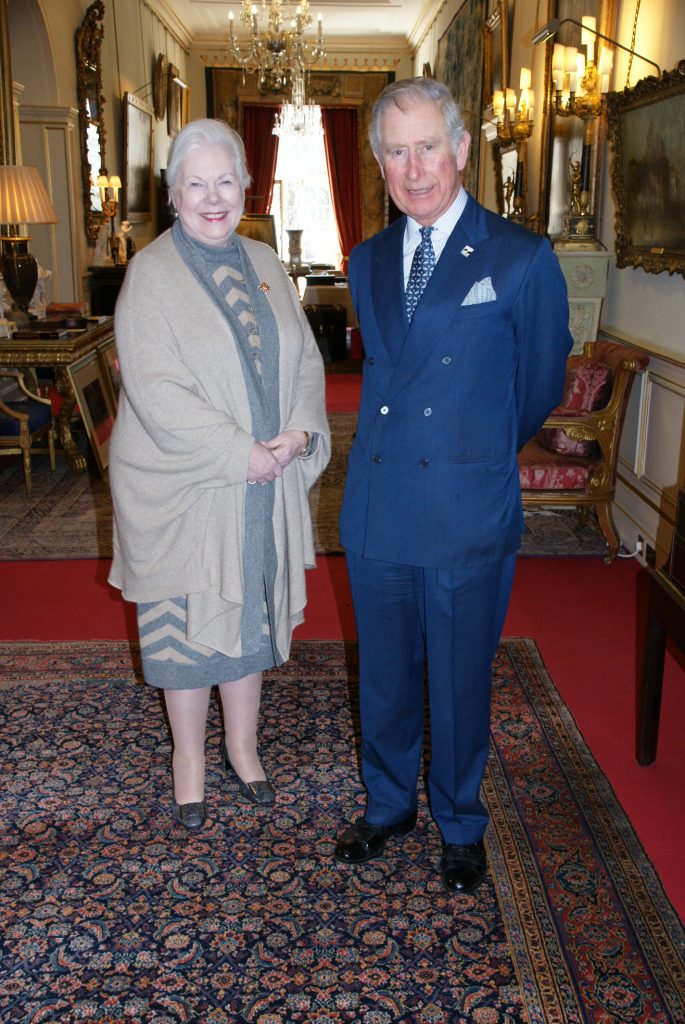 The Lieutenant Governor in a grey dress stands next to HRH Prince Charles who is wearing a blue suit