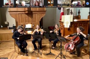 Screenshot of one of the virtual concerts. Musicians are seen playing their instruments while the Lieutenant Governor and other views watch the performance